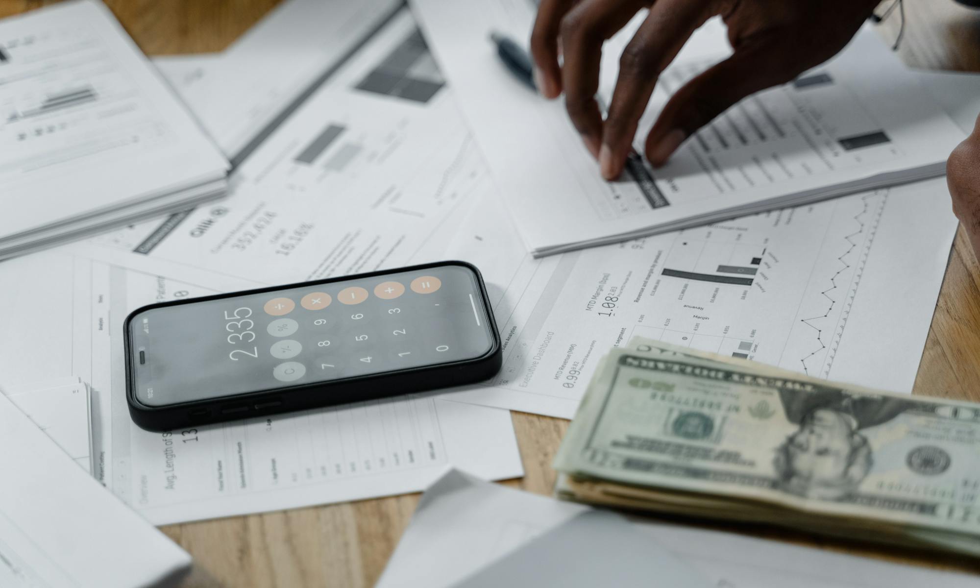 Calculator, phone, and bills while preparing a repayment plan